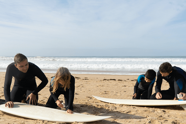 Teaching kids to surf on the beach