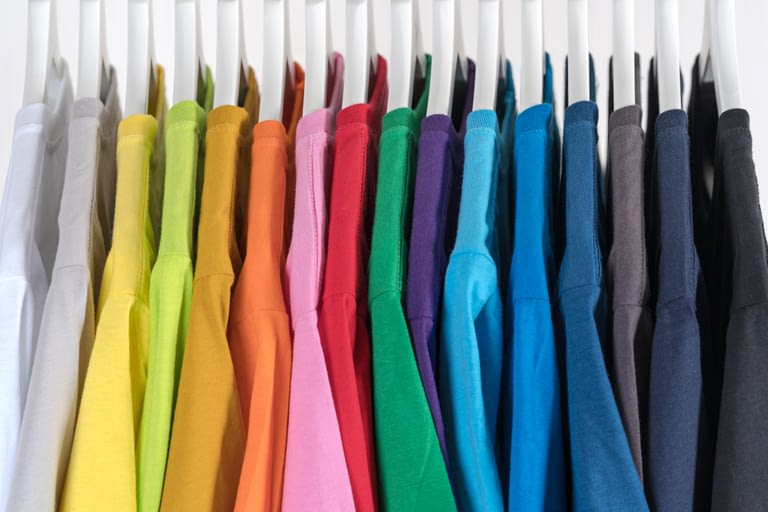 Colored t-shirts on hangers