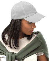 Female model wearing custom white baseball cap for company swag